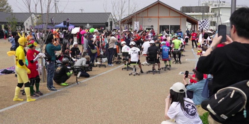 Teams race for rice in Japan's office chair endurance competition ...